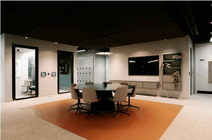 A modern conference room with integrated technology displays, and lighting, showcasing the role of high-performance building control cables in automating