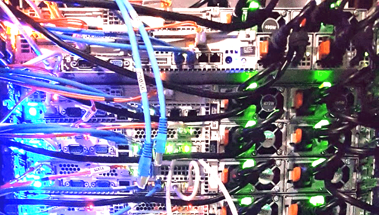 Server rack with numerous network cables and Ethernet cords, demonstrating complex cabling solutions with Cat 6 wires for high-speed, reliable network connectivity