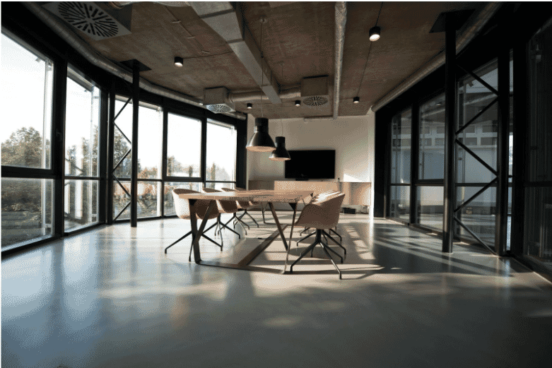Office with exposed ceilings and ventilation systems, emphasizing the need for fire life safety plenum wire for compliant wiring in high-risk environments